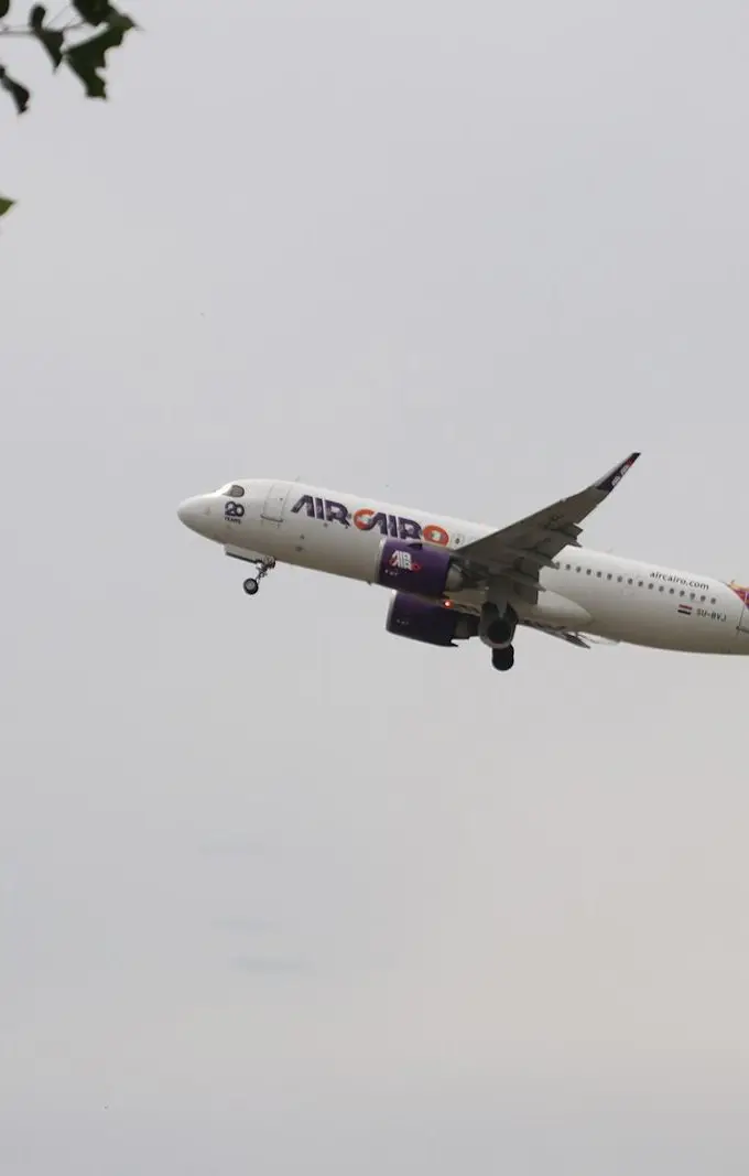 An Air Cairo Airbus A320 airliner on an airport apron