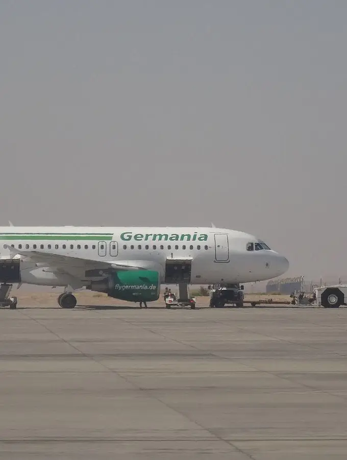 File photo of Marsa Alam International Airport: a white and green Airbus A319 in Germania livery, an airline that has since stopped flying, parked on the apron in front of the control tower. Not a photograph of Thursday's arrivals.